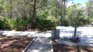 Looking west at south end of parking lot and start to sidewalk